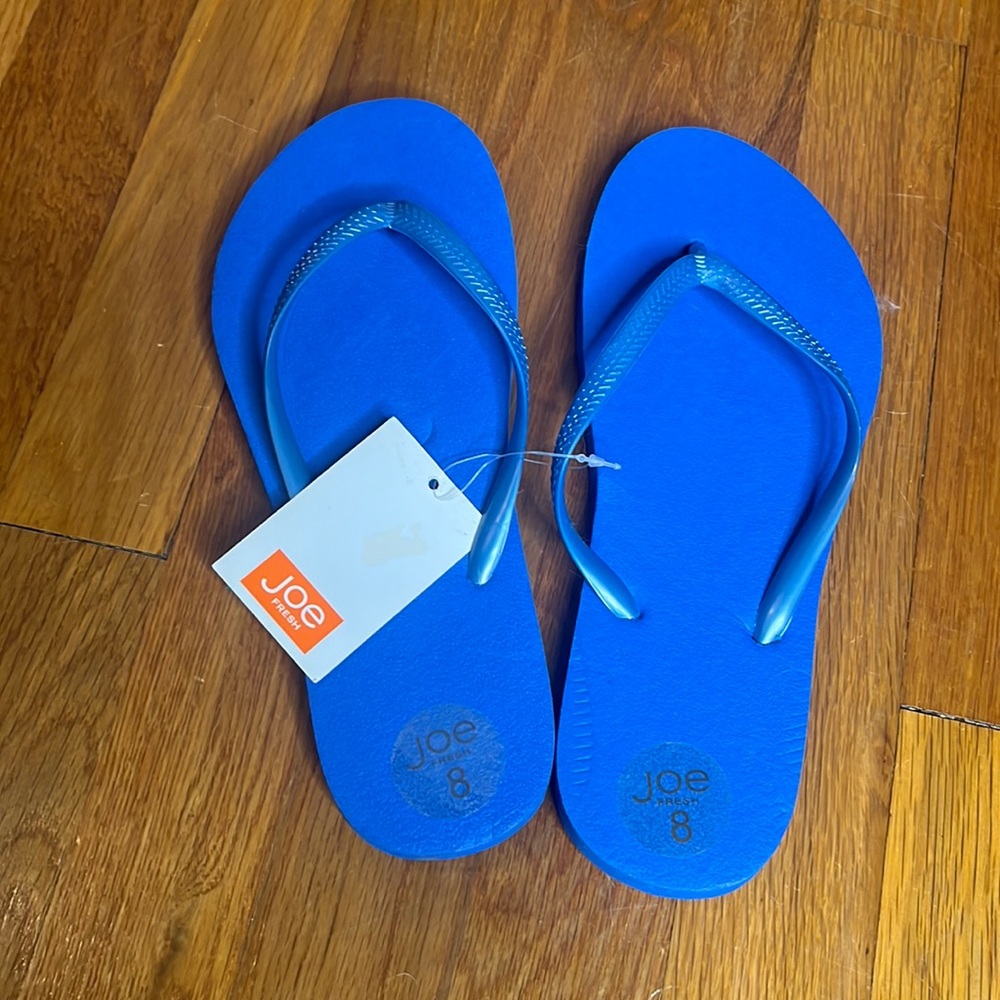 Women’s new vibrant blue flip flops by Joe size 8